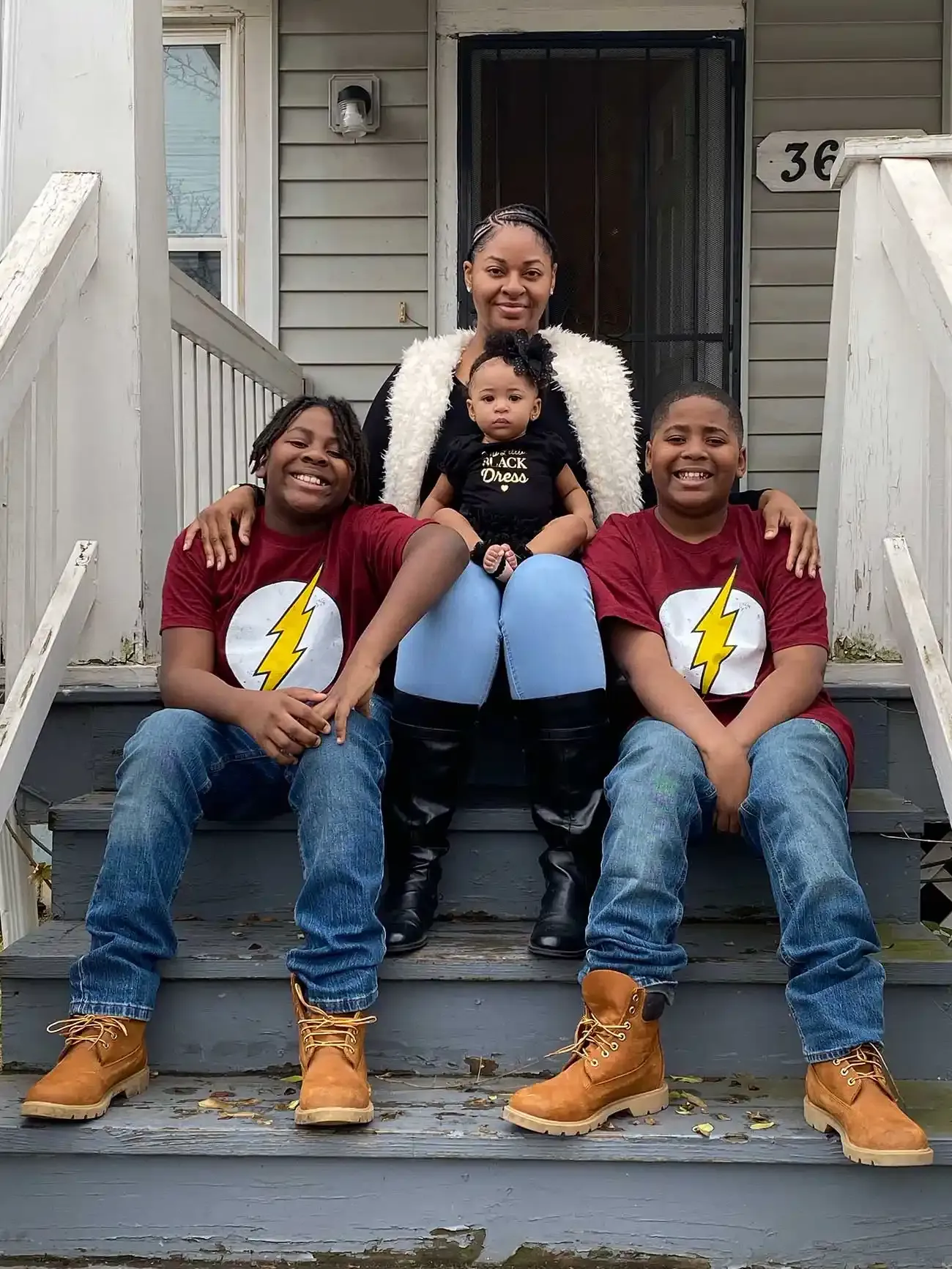Family on house porch