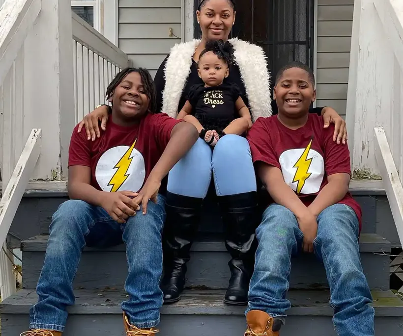 Family on house porch