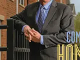 Man standing by fence