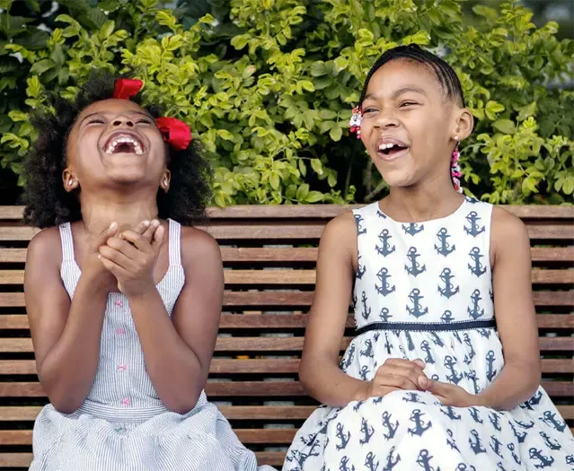 two girls laughing