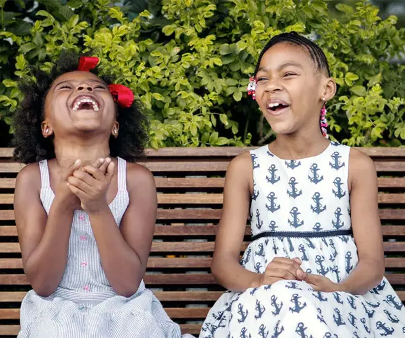 two girls laughing